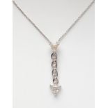 Pendant in 18kt white gold. With line of diamonds, oval and trilliant cut, color F-Light Brown,