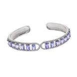 Open slave bracelet in 925 sterling silver with zircons set in grain and 6x4 mm oval tanzanites. set