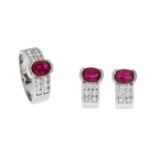 Set of ring and pair of earrings in 18kts white gold and rubies. With central rubies, oval cut,