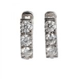 Creole earrings made in white gold centered by brilliant cut diamonds with a total of 1.11 cts (