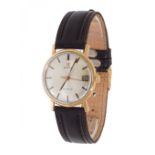 OMEGA Vintage watch in 18kt yellow gold. Circular case with silver dial. Applied numerals and