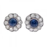 Pair of earrings in 18kts. white gold with central cabochon sapphire and diamond border, brilliant