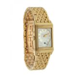 JAEGER LE COULTRE REVERSO DUE FASE watch, unisex in yellow gold. White dial, Arabic numerals,