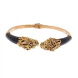 Open bracelet in 18kt yellow gold, onyx and diamonds, 70's.Open bangle with flexible hinge