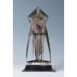 Jugendstil table clock, WMF. Germany, ca. 1905.Silver-plated tin-plated metal and glass.Table