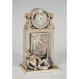 OTTAVIANI table clock in sterling silver. Second half of the twentieth century. Representing a