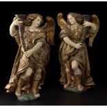 Pair of torch-bearing angels; Spain, second half of the 17th century.Carved, polychromed and