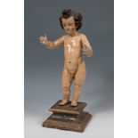 Andalusian school; 17th century."Child Salvator Mundi".Carved and polychrome wood.It presents