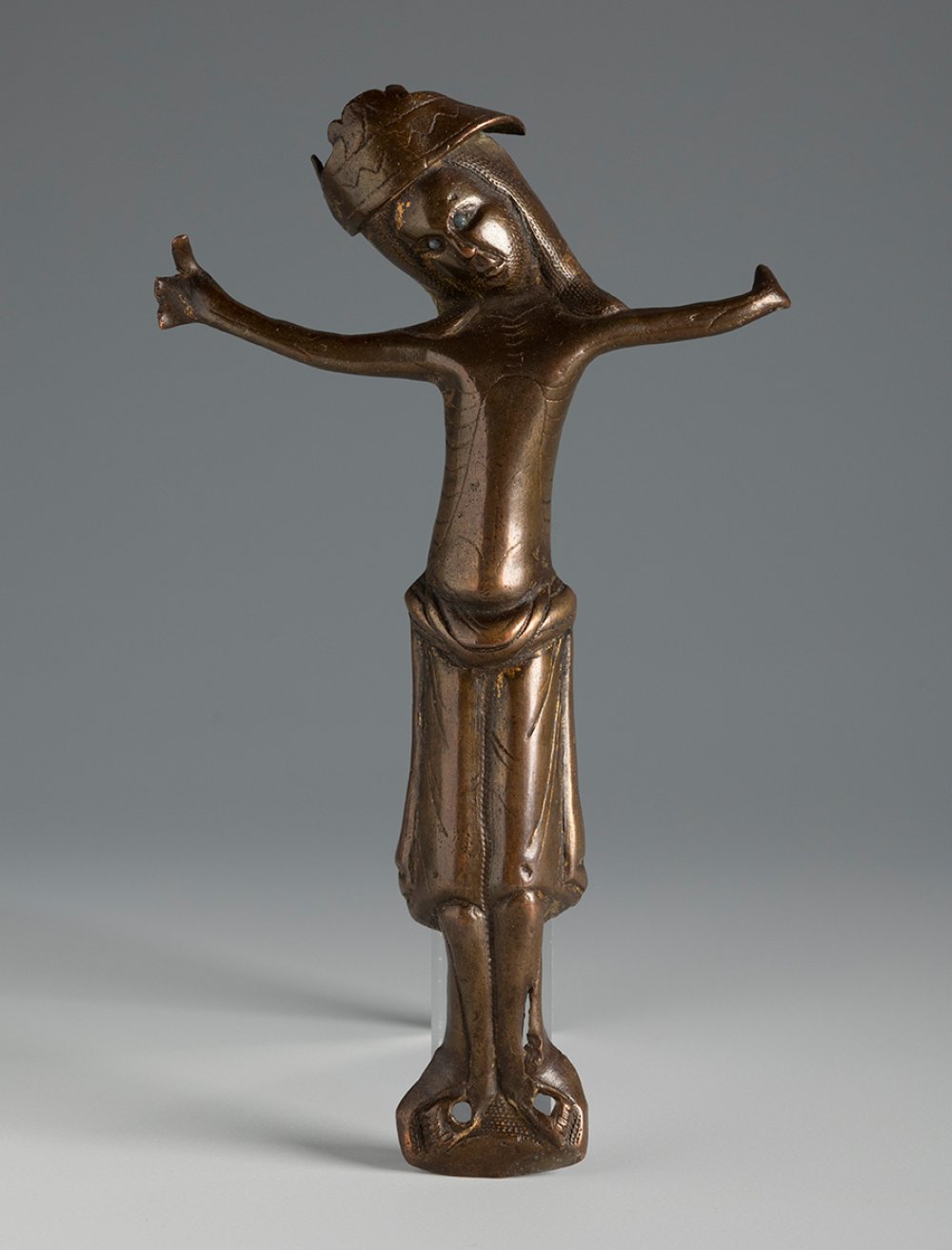 Transitional Romanesque-Gothic Christ, 13th century.Bronze.On upholstered wood.Measurements: 17 x 10