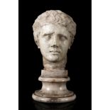 Male head. Rome, 1st century AD.Marble.Size: 30 x 15 x 15 cm.The protagonist of this sculpture, a