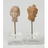 Pair of female heads; Tanagra, Grace, Boeotia, 3rd century BC.Terracotta.Size: 3 x 2 x 2 cm; 2 x 2 x