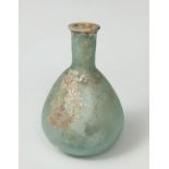 Balsamarium; Rome, 2nd-3rd century AD.Blown glass with iridescence.It is in a good state of