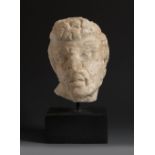 Satyr's head. Roman culture. 1st-2nd century AD.Marble.Provenance: Private collection, USA. Acquired