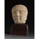 Head. Cyprus, 6th century BC.Limestone.Provenance: Private collection of Columbia University