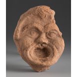 Theatrical mask. Smyrna, 3rd century BC.Terracotta.Provenance: Smyrna, 1895-1905. Collection Paul