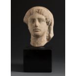 Votive head. Rhodes, Greece, 480-450 BC. Terracotta. Provenance: Found in Rhodes, Greece. Private