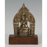 Altar with Buddha; China, 18th century.Embossed bronze.Attached to a base of a later period.