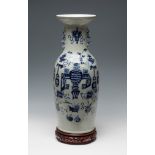 Chinese vase. Qing Dynasty, 19th century.Hand-painted celadon glazed porcelain.Carved wooden stand.