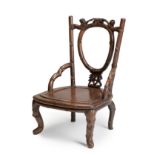 Rare and unusual low armchair. China, late Qing dynasty, 19th century.Carved hongmu (sourwood) or