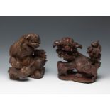 Two Foo dogs, Qing dynasty. China, 18th century.Carved, polychromed and gilded wood.Some flaws and