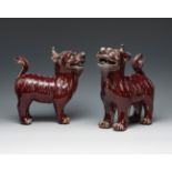 Pair of Foo "sang de boeuf" dogs, Qing dynasty. China, 19th century.Hand-polychromed porcelain.Red