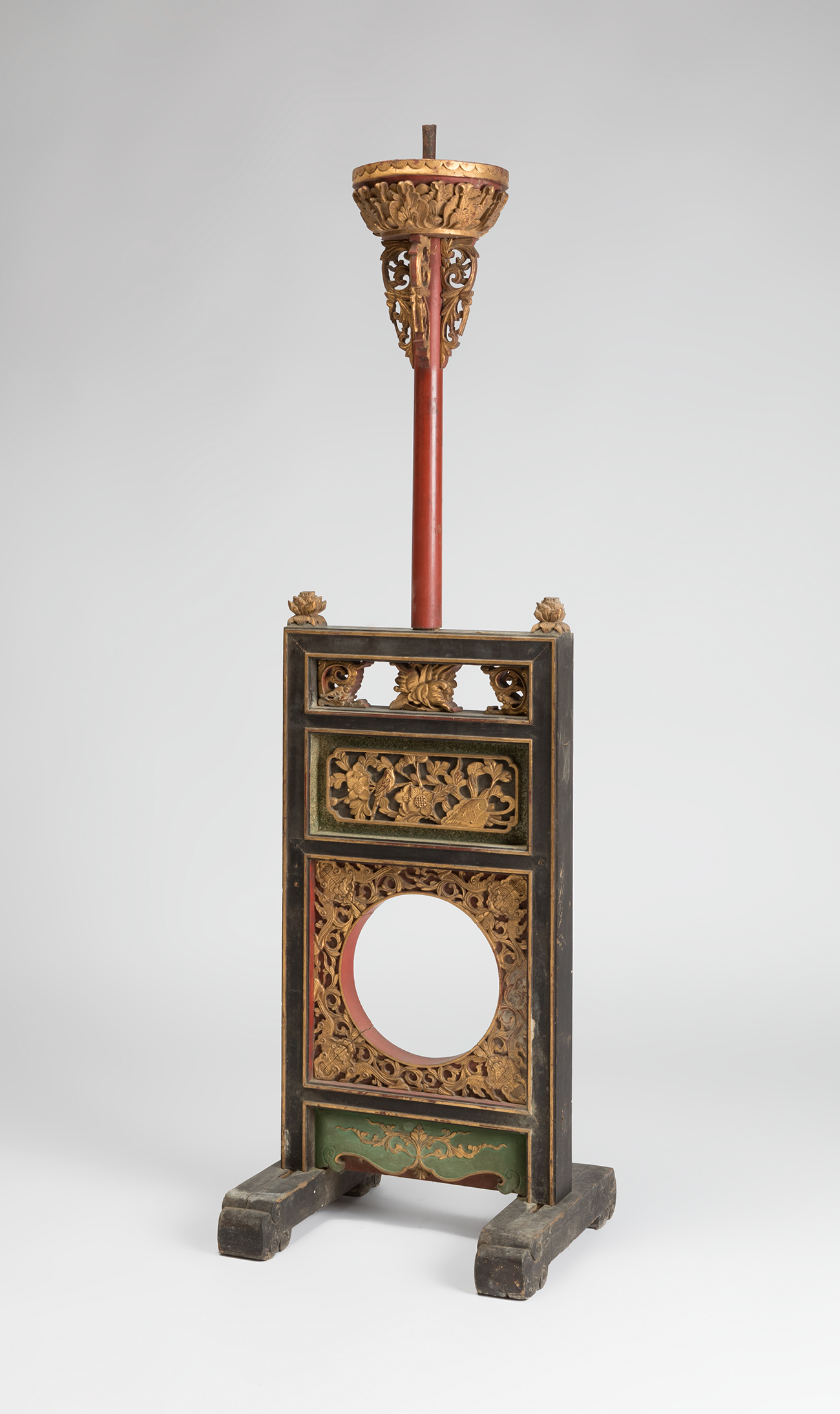 Palatial floor lamp. China, late Qing dynasty, 19th century.Carved polychromed and gilded wood.