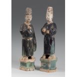 Dignitary couple. China. Ming Dynasty, 17th century.Glazed ceramic.Measurements: 40 x 10 x 10 cm.