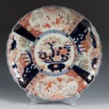 Imari dish. Japan, Meiji period, second half of the 19th century.Glazed porcelain.Presents