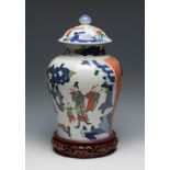 Chinese Tibor. Qing Dynasty, 19th century.Hand-painted porcelain.Carved wooden stand.Hair on one