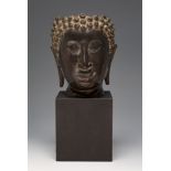 Bodhisattva head. Possibly Thai, 17th-18th century.In bronze.Part of the skull is missing.Wooden
