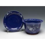 Qing dynasty pot with saucer. China, early 20th century.Hand-glazed porcelain.Remnants of what may