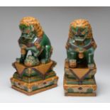 Pair of Foo dogs, Qing dynasty. China, late 19th, early 20th century.Hand-polychromed porcelain.