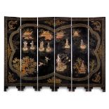 Asian folding screen; 19th century.Lacquered wood and hard stones.Slight flaws.Measurements: 185 x
