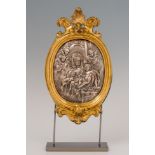 Italian school; 18th century."Madonna and Child with angels.Silver relief.Measurements: 30 x 17.5