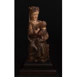 Spanish Gothic school; 14th century."Virgin of the milk".Carved and polychromed wood.It has faults
