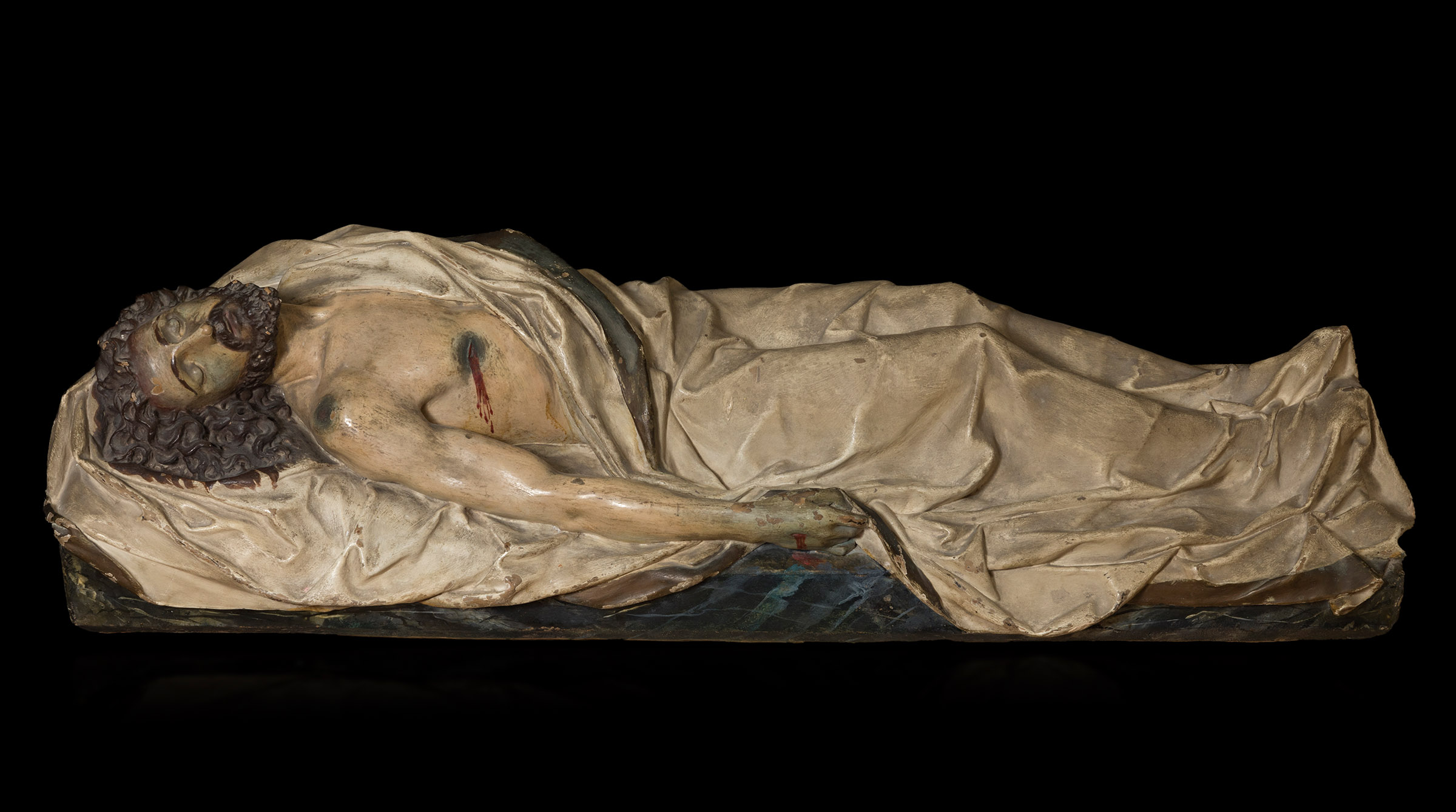 Spanish school; 18th century."Recumbent Christ".Polychrome terracotta.It has slight faults.