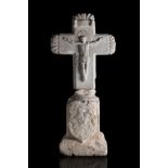 Cross and pedestal; 16th and 18th centuries.Stone carving.Pedestal adapted to the carving of the