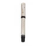 MONTEGRAPPA FOUNTAIN PEN "COSMOPOLITAN AFRICA", 1997.Embossed silver barrel and black resin.