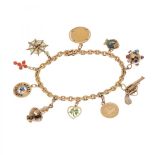 18kt yellow gold link bracelet with 10 pendants in various shapes (spider web, coin, fish, molecule,