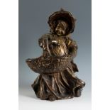 ESTEVA Y CIA. Catalonia, ca. 1900."Girl with basket".Patinated terracotta.With stamp of the