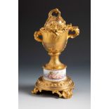 Louis XVI style goblet. France, late 19th century.Gilt bronze and porcelain.Slight wear on the