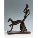Female figure with dog in the style of KARL HAGENAUER (1898-1956), 20th century.Patinated wood.
