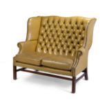 Eared sofa from the first half of the 20th century.Upholstery upholstery chester type capitonné in