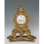 Louis XV style clock; late 19th century.Gilt bronze.Signed dial.Preserves key and pendulum.