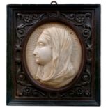 Italian workshop, early 18th century.Carved marble medallion with high relief of the Virgin Mary.