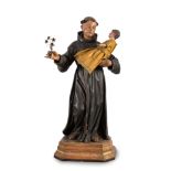 Spanish school ca. 1800."Saint Anthony of Padua with Child".Carved and polychrome wood. Lilies in