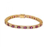 Bracelet in 18k yellow gold. Articulated model outlined by groups of four brilliant-cut diamonds,