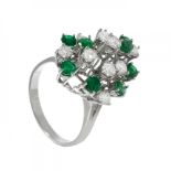 Ring in 18kt white gold. Ballerina model with brilliant-cut diamonds with ca. 1 cts. and emeralds,