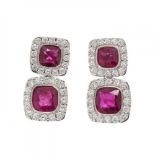 Pair of double rosette earrings in 18k white gold. With central rubies bordered by brilliant-cut