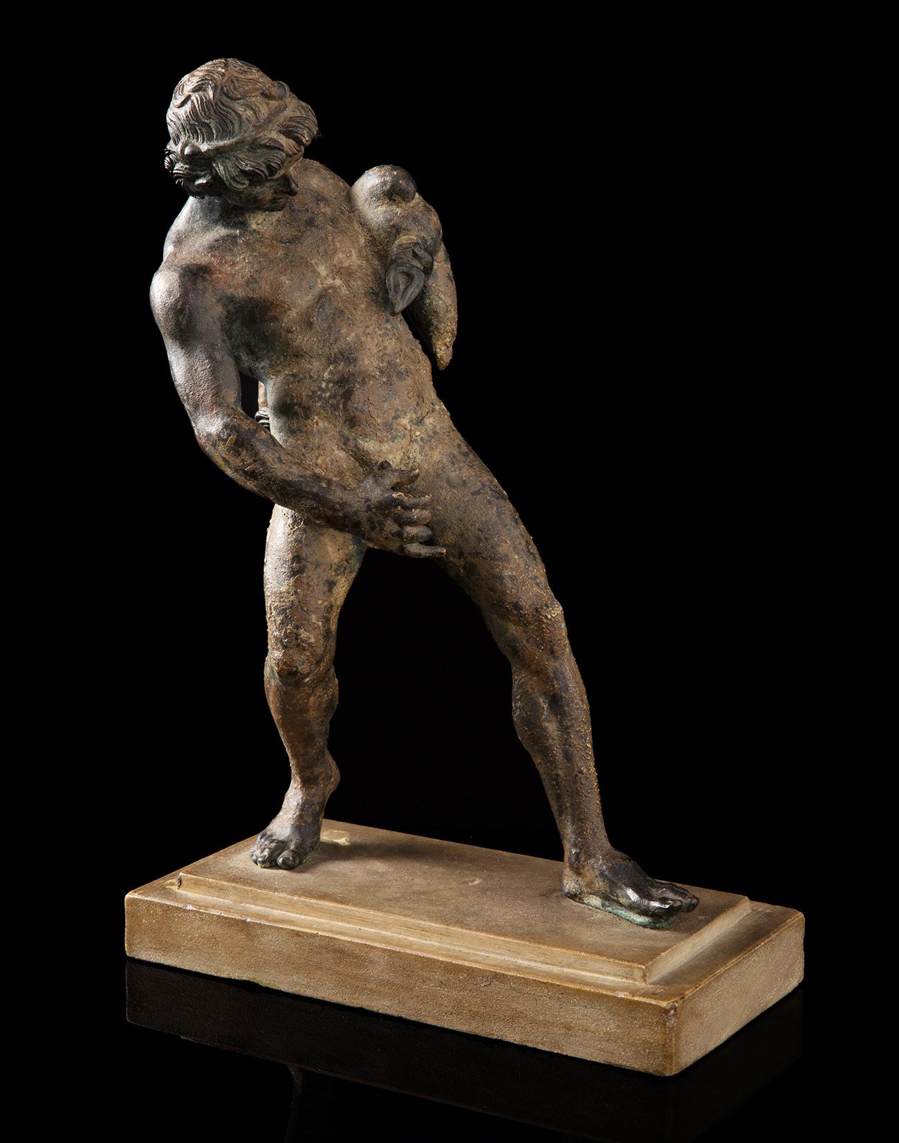 Italian school; "Grand Tour", 19th century."Satyr with a boot".Bronze.Measures: 34 x 23 x 11 cm.